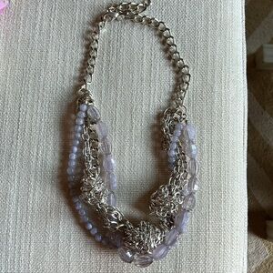 Super cute costume necklace with silver plated, metal and light purple beads.